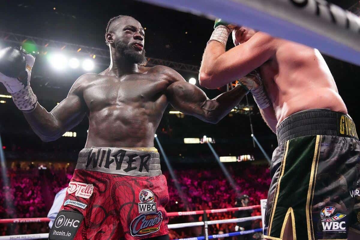Deontay Wilder throws a punch in the Tyson Fury trilogy