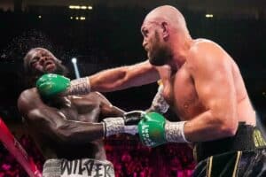 Heavyweight champ Tyson Fury punches Deontay Wilder